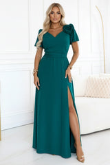 653-1 Elegant long dress with a rose, belt and high slit - bottle green